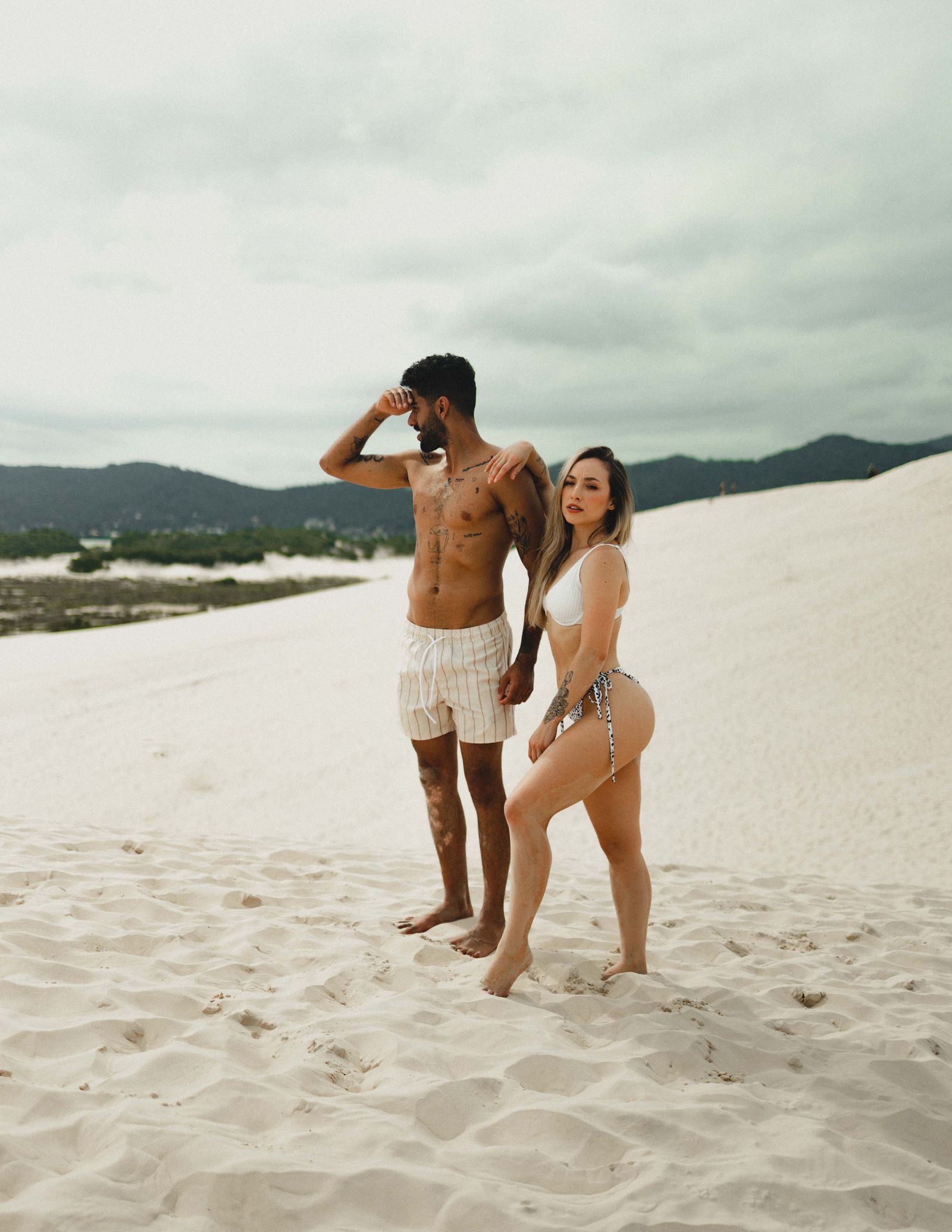 Couple posing together on the beach