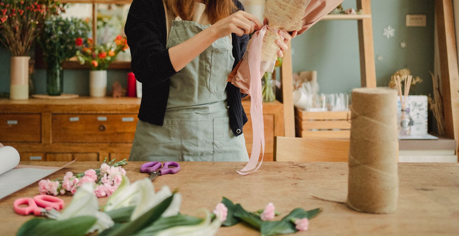Florist arranging a bouquet in the shop